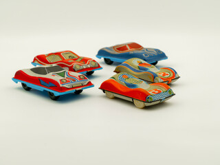Collection of vintage tin toy cars. Antique small race cars in different colors