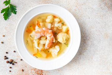 seafood soup shrimp, vegetables healthy meal food snack on the table copy space food background rustic