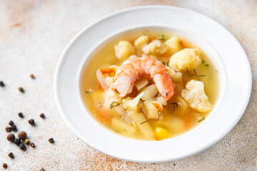 seafood soup shrimp, vegetables healthy meal food snack on the table copy space food background rustic