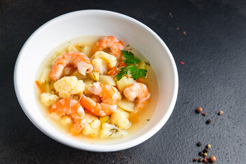 seafood soup shrimp, vegetables healthy meal food snack on the table copy space food background rustic
