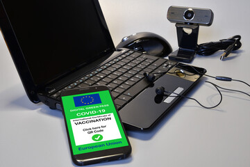 Covid-19 green passport. The digital green pass of the European Union on the screen of a smartphone...