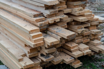 Close up photo of stack Of wooden planks on a storage