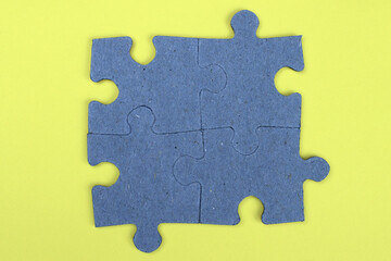 Fototapeta premium Puzzle pieces on a yellow background