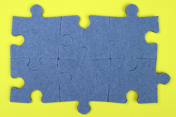 Puzzle pieces on a yellow background