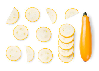 A set of whole and sliced yellow zucchini isolated on white background. Top view.