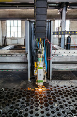 CNC machine for laser cutting sheet metal in a production area, close-up. The picture was taken in Russia, in the workshop of a mechanical plant