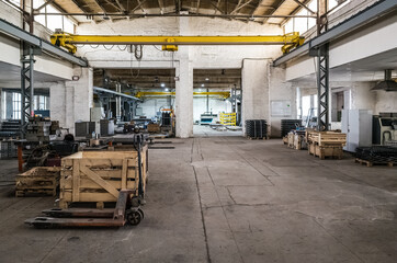 Fototapeta premium Manufacturing premises of an industrial plant with equipment and products. The picture was taken in Russia