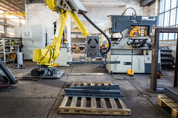 Robot manipulator in the production room of an industrial plant. The picture was taken in Russia