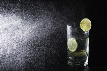 Lime water. Drinking water with fresh lime. Mineral water. Healthy, mineral-rich, refreshing water with lime.