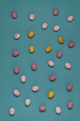 Yellow, white and pink chocolate eggs for Easter celebration.