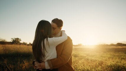 Romantic Couple Hugging at sunset