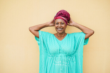 Happy senior african woman looking at camera - Focus on face