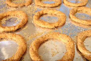 Fresh Turkish bagel on the tray. Simit.