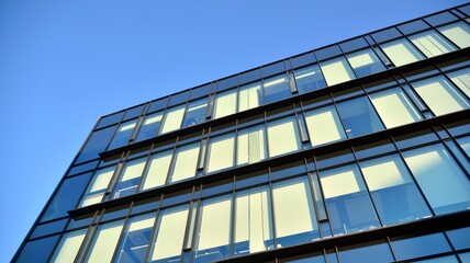 Cityscape office buildings with modern corporate architecture - business and success concept. Glass facade of the building. 