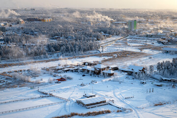 Yakutsk city on a winter day. View from a height of the ethnographic tourist complex 