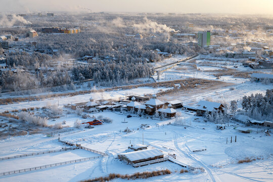 Yakutsk city on a winter day. View from a height of the ethnographic tourist complex "Chochur Muran". Winter landscape in the city
