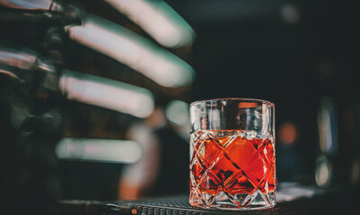 Cocktail Negroni with gin, campari martini rosso and orange. negroni cocktail at the bar