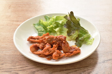 grilled pork with Bulgogi sauce Korean food eat couple fresh vegetable on plate
