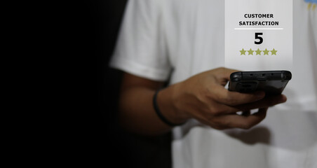 Five stars (5) rating with a businessman is touching virtual computer screen.For positive customer feedback and review with excellent performance