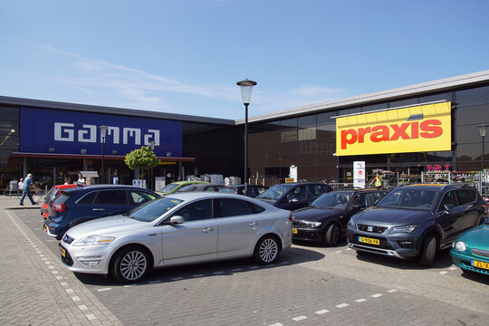 Two Dutch hardware stores (Gamma and Praxis are the two biggest Dutch Hardware store chains) next to each other with a parking space for visitors in Heerhugowaard. Netherlands