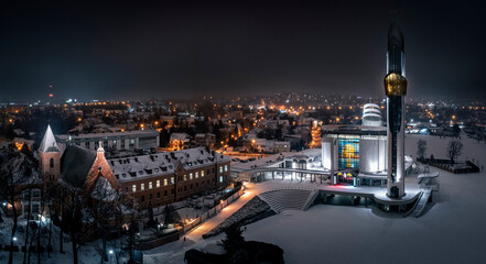 Divine Mercy Sanctuary in Krakow, Poland at snowy, winter night.