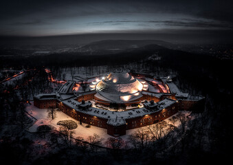 Aerial view of Kosciuszko Mound and fortress in Krakow during winter night, Poland