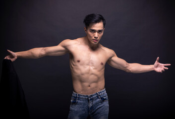 Fototapeta na wymiar Asian young man with fitness body