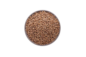 Raw buckwheat in bowl on white background isolated. Top view