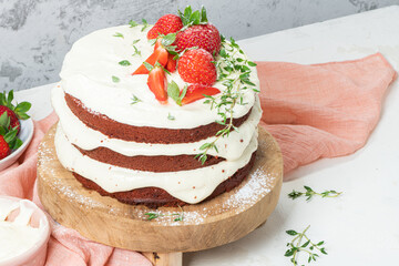 Red velvet cake on wood board. Strawbwrry cake. Devils cake. Wedding dessert. Birthday party. Delicious dessert. Traditional american dessert.