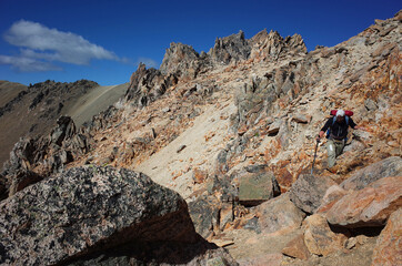 Trekking in Patagonia deserted mountains, Nahuel Huapi National Park, Man hiking on Cerro Catedral mountain steep granite rocks, Argentina hike outdoor adventure