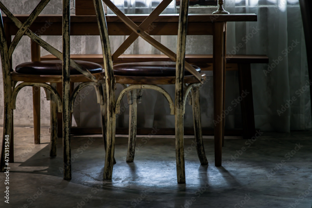 Wall mural Two old wooden vintage chairs standing in an empty room near the window. Space for text, No focus, specifically.