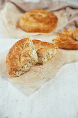 Baking from puff pastry, Vertuta or placinda with cottage cheese and cheese.