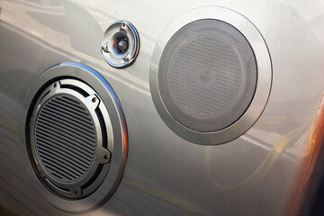 Several different speakers built into the hull of the yacht. Built-in speakers in the vehicle.