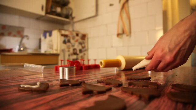 Making cookies. Molding cookie dough. Female hands making cookies on table in kitchen (Soviet Union old flat)