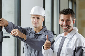 two builders are working indoors