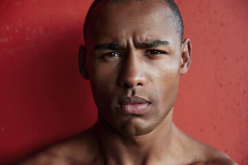 Portrait of athletic black man looking at camera