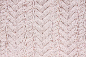 Cable knitting stitch pattern, dust pink color, soft wool knitted clothes texture