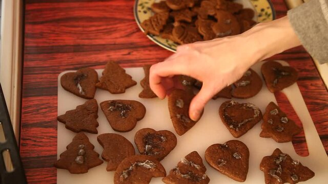Making cookies. Molding cookie dough. Female hands making cookies on table in kitchen (Soviet Union old flat)