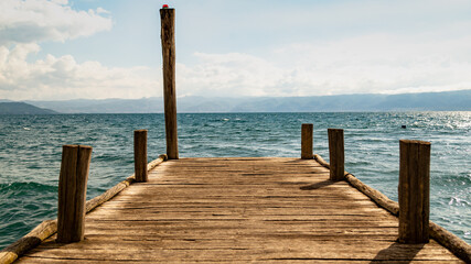 Rustic wooden pier on the lake