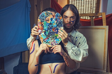 Fototapeta premium art portrait of a young couple. artist man and woman body art