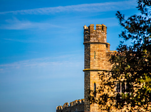 Leeds Castle Tower Detail, With Foliage In The Foreground. Sunset.