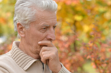 Close up portrait of senior man outdoors