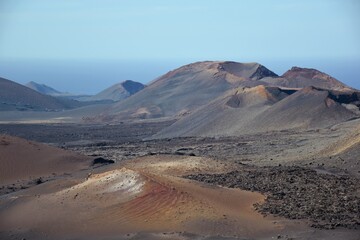 Fototapeta na wymiar Colorful volcanic craters in Timanfaya National Park, Lanzarote, Canary islands, Spain