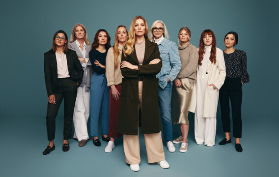 Cross-armed Woman Standing With A Group Of Diverse Women