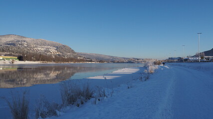 Fototapeta na wymiar River running through winter landscape