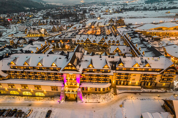 Bania Hotel and Ski Resort in Bialka, Poland at Winter. Drone View at Night