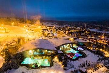 Bania Thermal Baths and Ski Resort Drone View at Winter Night, Poland - obrazy, fototapety, plakaty
