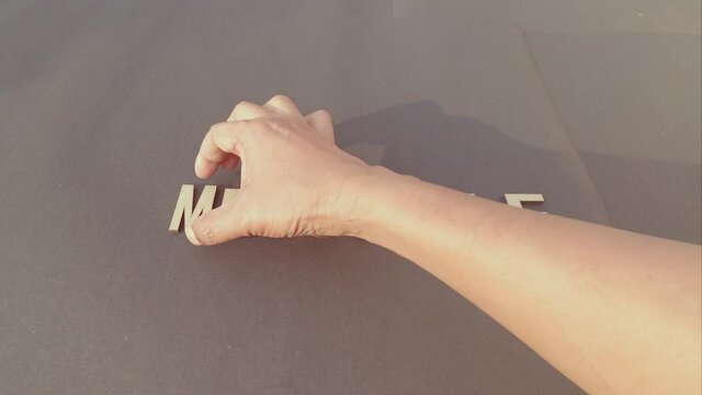 Impossible Means I&rsquo;m Possible If You Know How To Begin - Man hand separating I M letter from impossible an adding a smiley to say possible. Success and achievement determination concept.