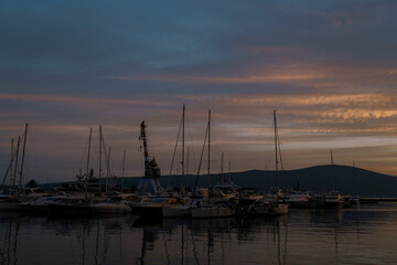 Dusk over the marina with moored yachts in Porto. Montenegro