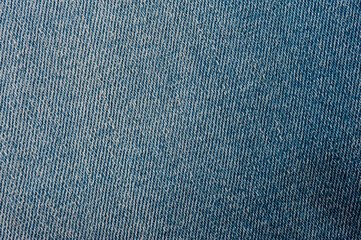 Close up of blue denim texture with sewing.